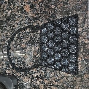 Unbranded ladies beaded black purse. Zipper closure